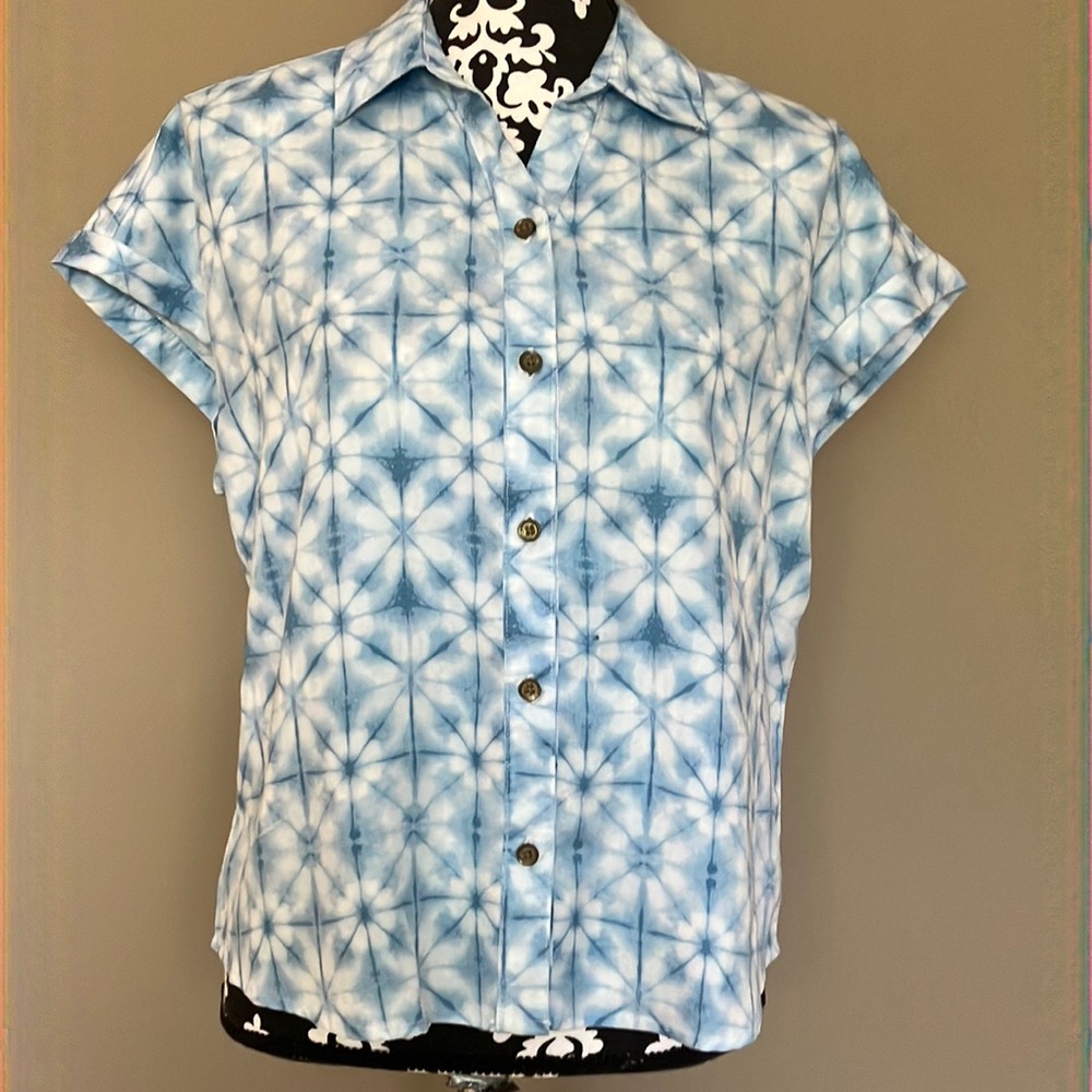 Blue and white shibori button up blouse with shirt sleeves.